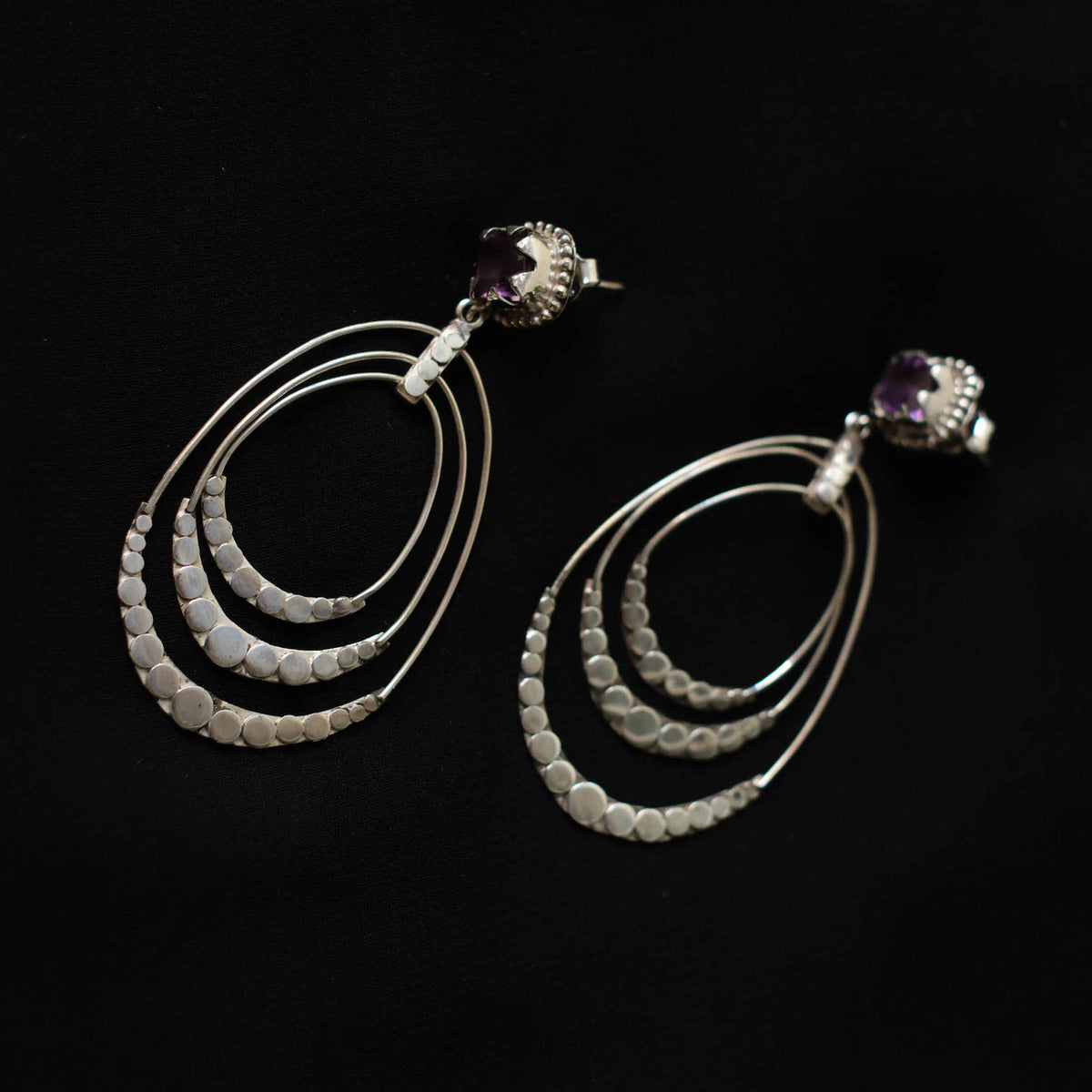 Earrings with faceted amethyst