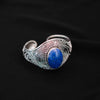 Pulsera artesanal hecha a mano con plata de ley, técnica del granulado y cabujón de lapislázuli. Ancho  4´5 cm Tamaño ajustable Peso 36 g. Hand made silver bracelet with lapislazuli. Lula Máiz